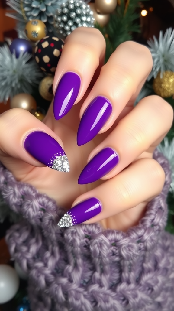 Close-up of bold purple nails with crystal tips