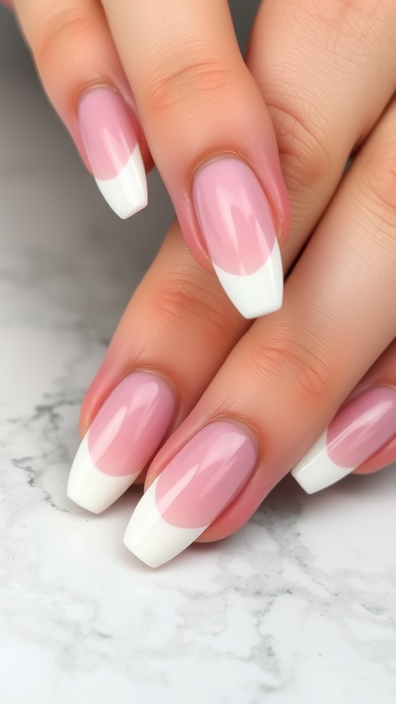 Nails featuring a classic French tip design with a pink base and white tips.