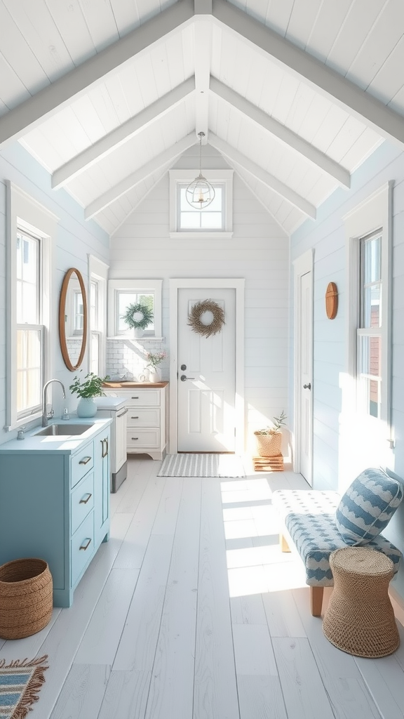 Interior of a coastal tiny house showcasing a light and airy design with blue walls, white ceiling, and natural decor elements.