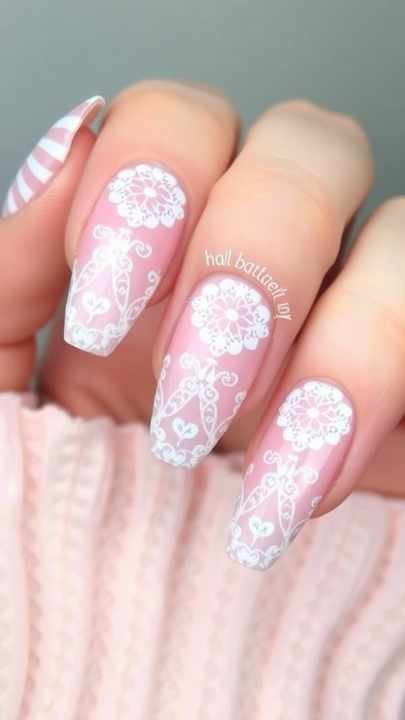 Nails featuring romantic lace detail with a pink base and white lace design.