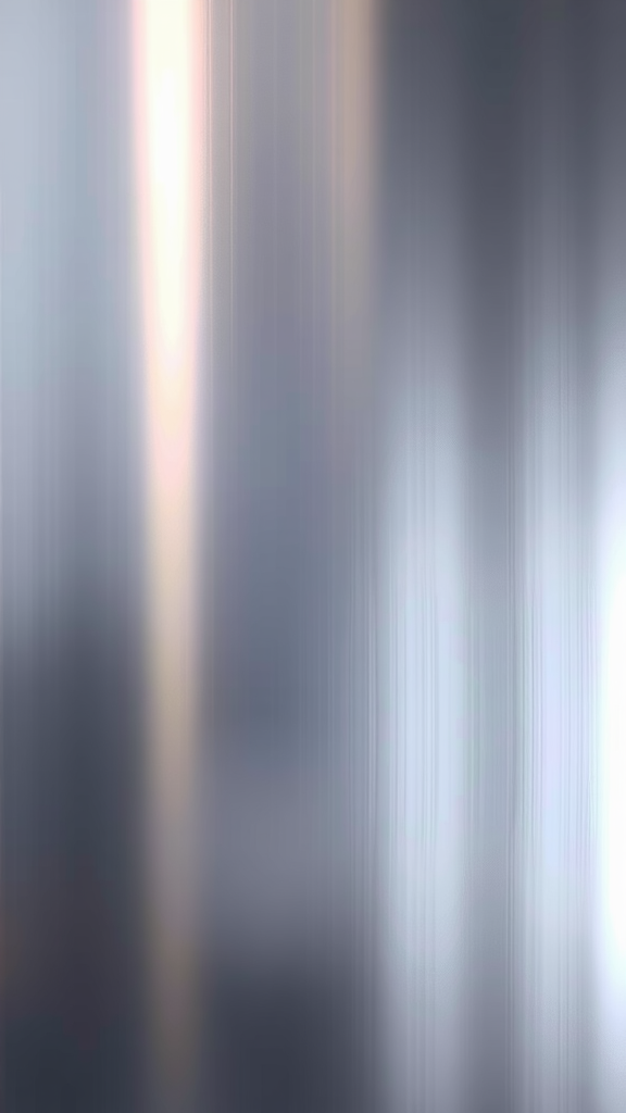 An abstract representation of sleek metallic textures with a gradient of silver and light.