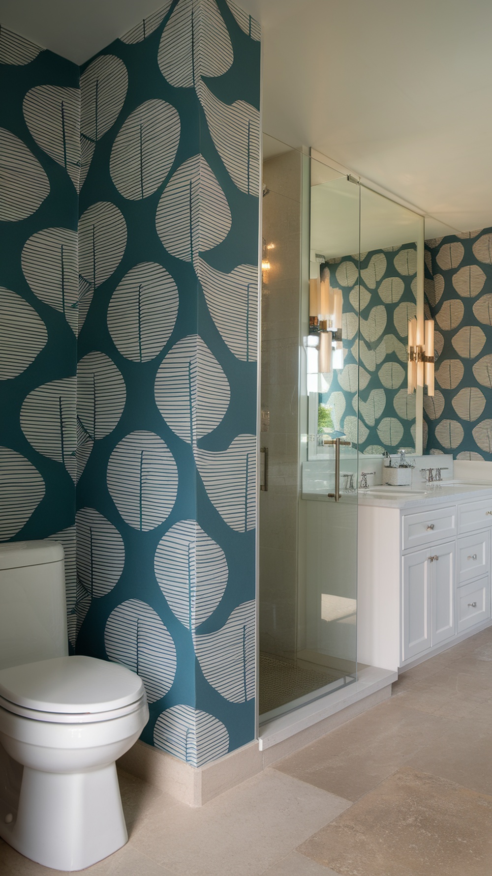 A bathroom featuring a bold accent wall with teal color and leaf patterns.