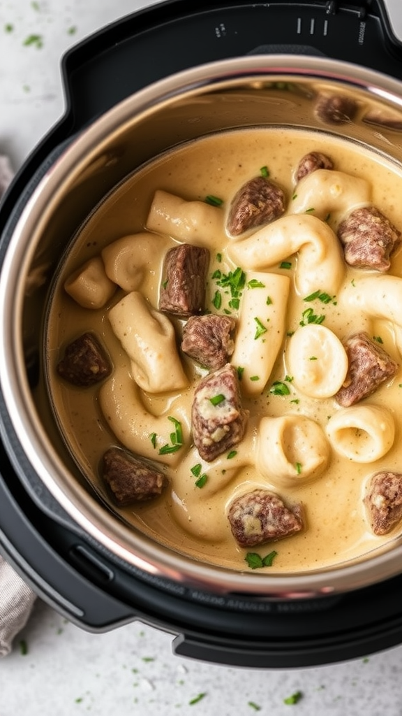 Instant Pot Stroganoff with noodles and beef chunks in a creamy sauce