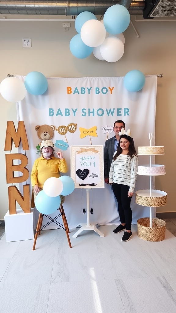 Photo booth setup for a baby boy baby shower with balloons, a teddy bear, and decorative letters.