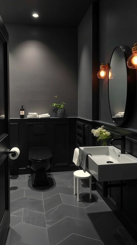 A chic jet black bathroom featuring dark tiles, a modern sink, and warm lighting.