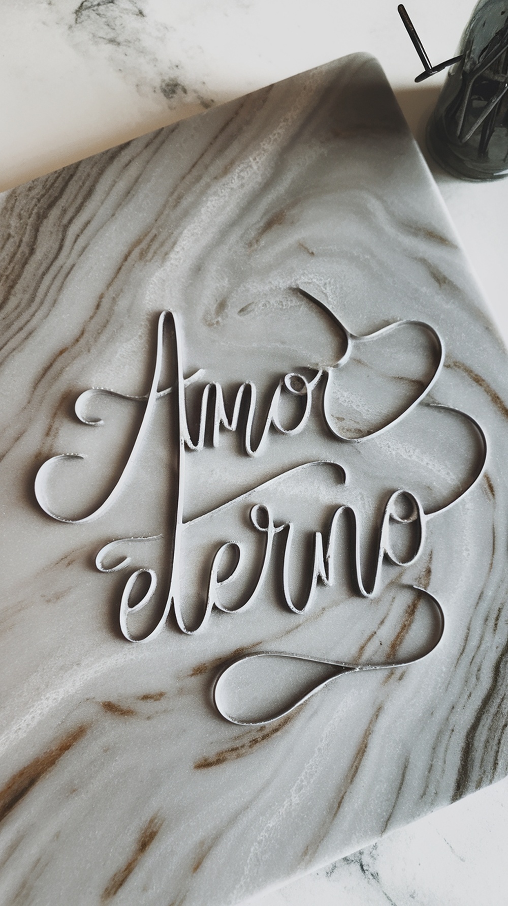 A marble nail design showcasing a water swirl technique.