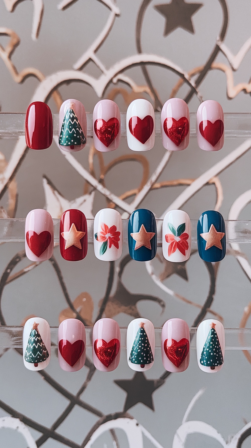 A collection of seasonal themed nail designs featuring Christmas trees, hearts, and flowers.