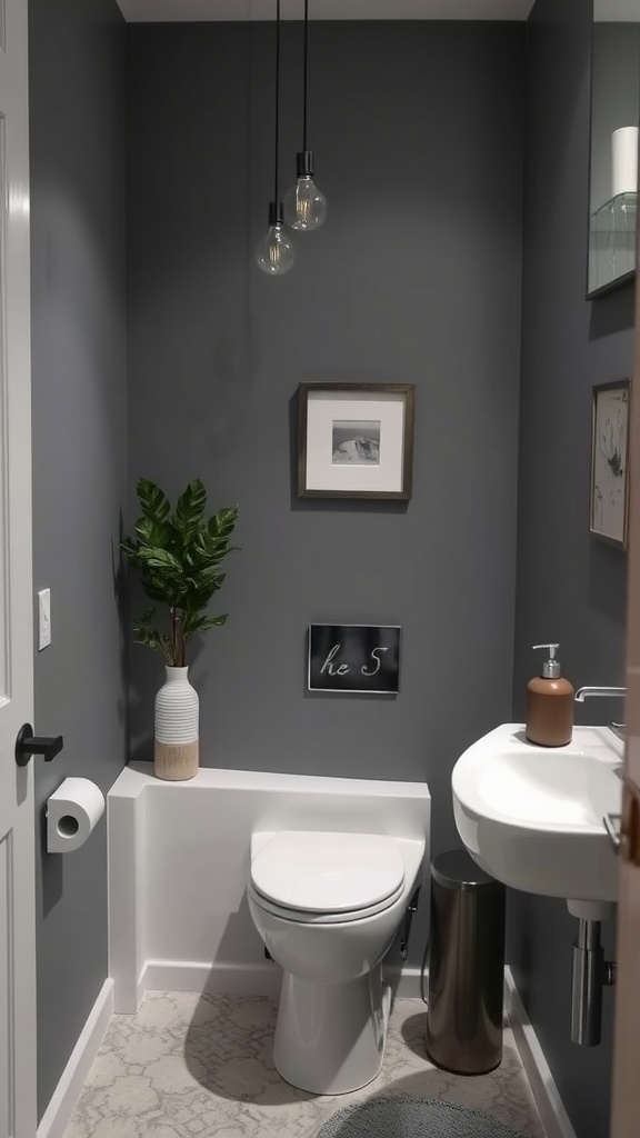 A small bathroom with muted gray-blue walls, a plant, and modern fixtures.