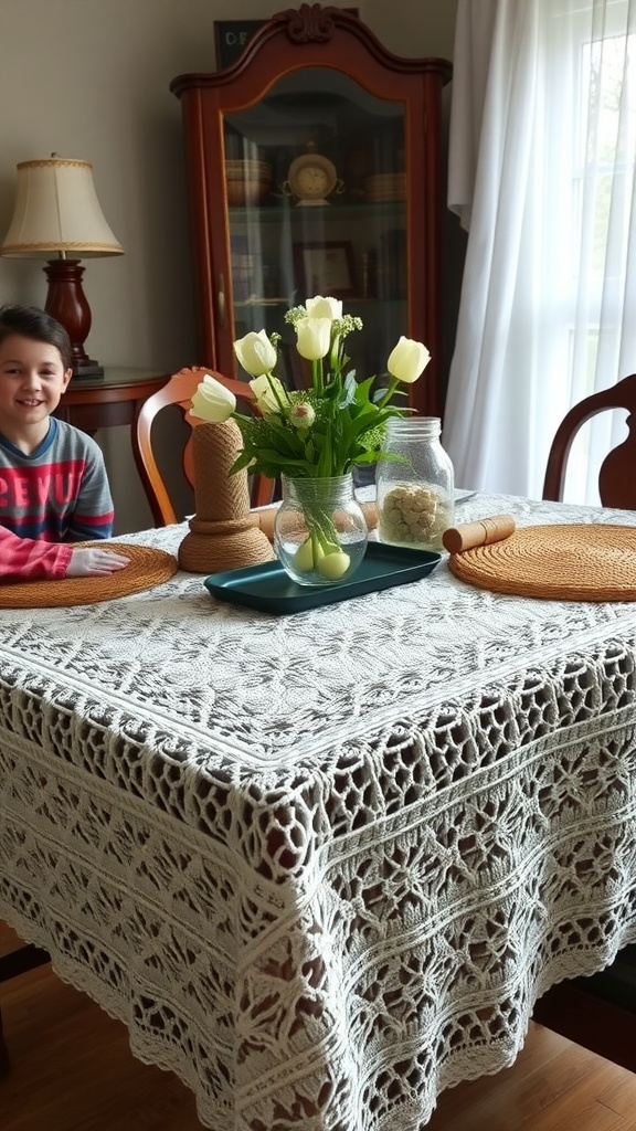 A cozy dining table featuring a handmade crochet tablecloth, with a vase of flowers and a warm atmosphere.