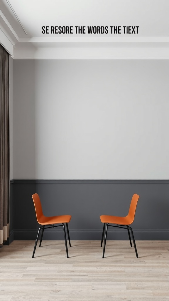 Modern room with two-toned walls featuring a gray chair rail and vibrant orange chairs.