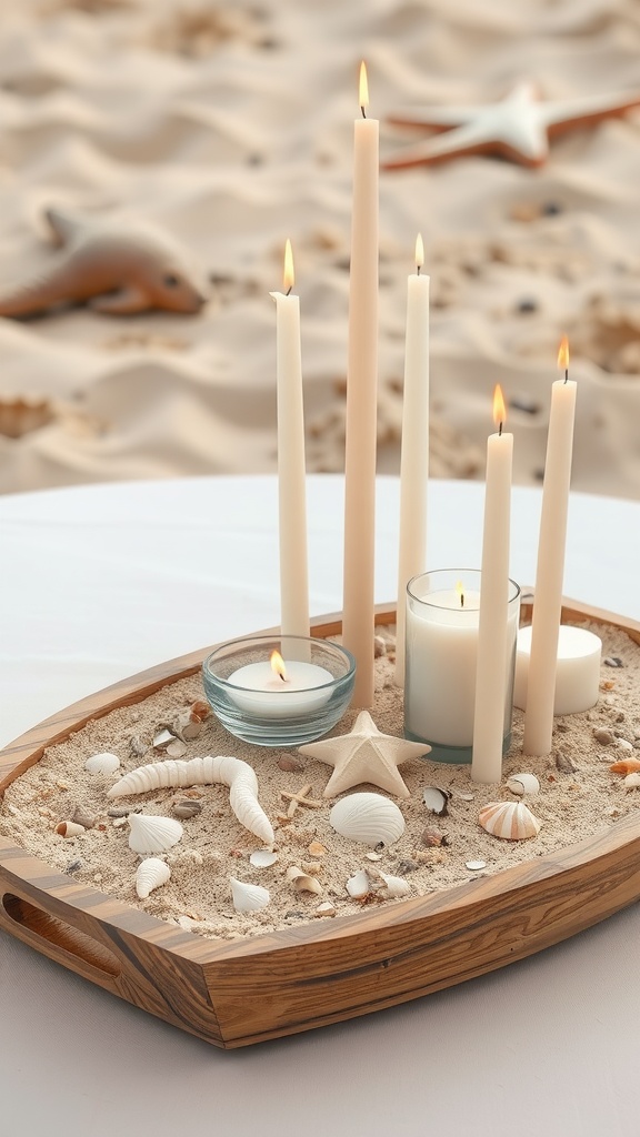 A wooden tray filled with sand, candles of various heights, and small shells, creating a beach-themed centerpiece.