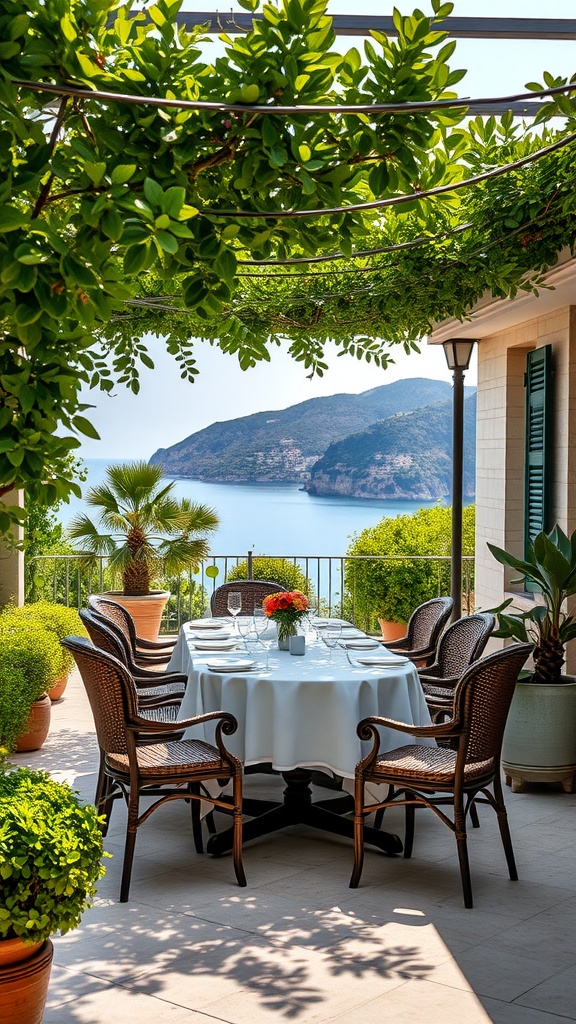 An elegant outdoor dining table set with a light blue tablecloth and wicker chairs, surrounded by greenery and a view of the sea in Sardinia.