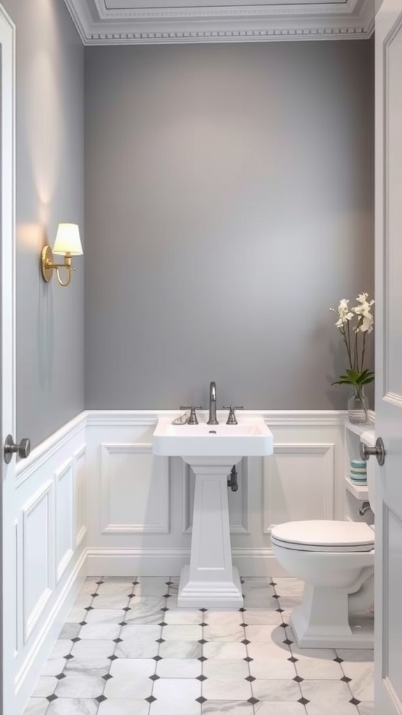 A stylish gray bathroom featuring white wainscoting, elegant fixtures, and a patterned floor.