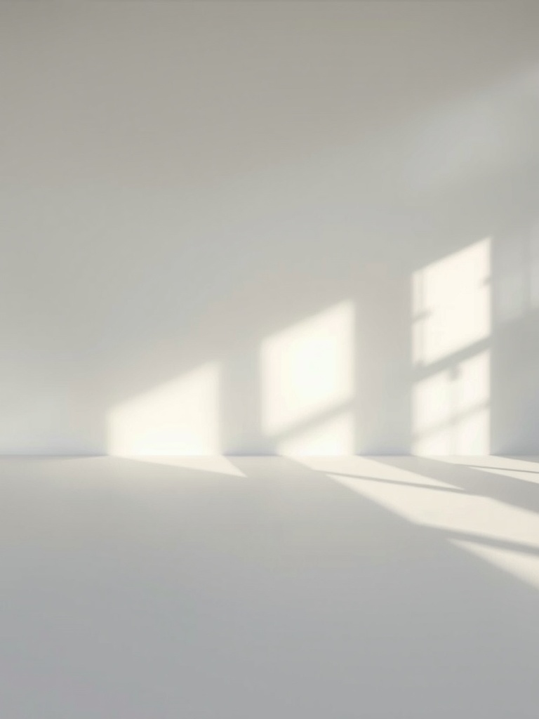 A minimalist room with soft light and subtle shadows on the walls.