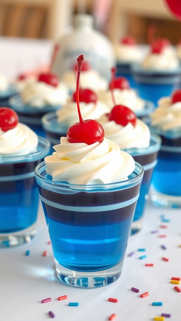 Blue jelly cups topped with whipped cream and cherries on a table