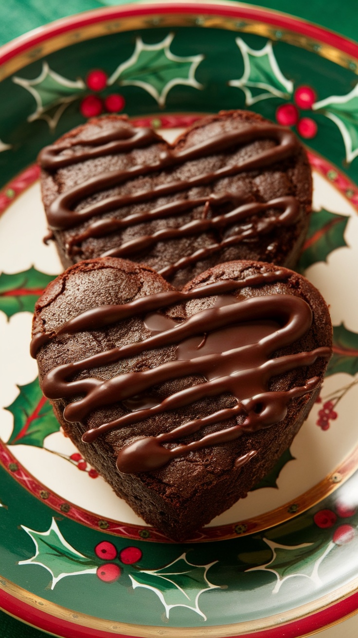 Two heart-shaped brownies drizzled with chocolate ganache on a festive plate