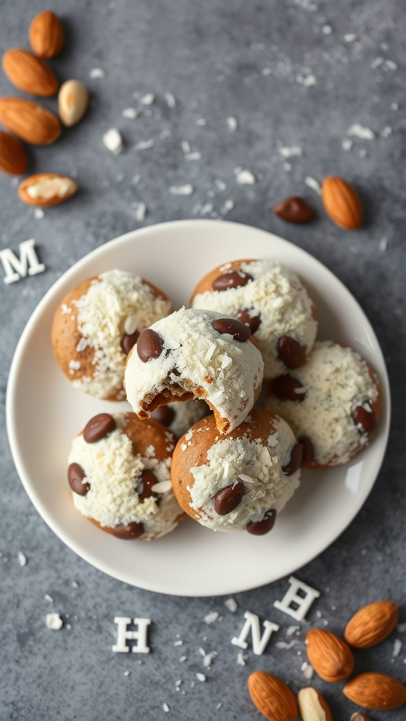 A plate of Almond Joy cookies topped with shredded coconut and chocolate chips, surrounded by almonds.