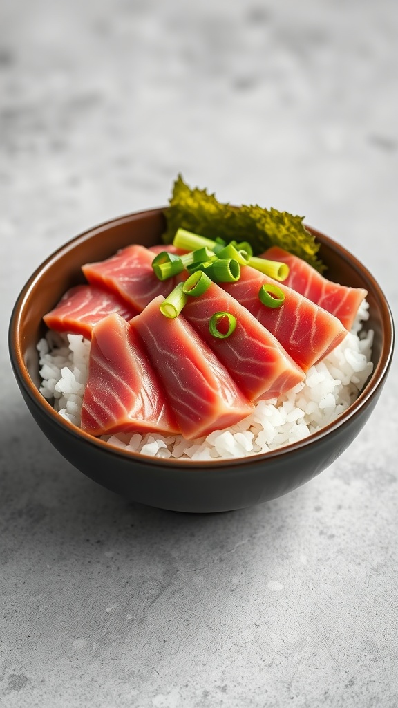 A bowl of sushi-style tuna and rice topped with sliced green onions.