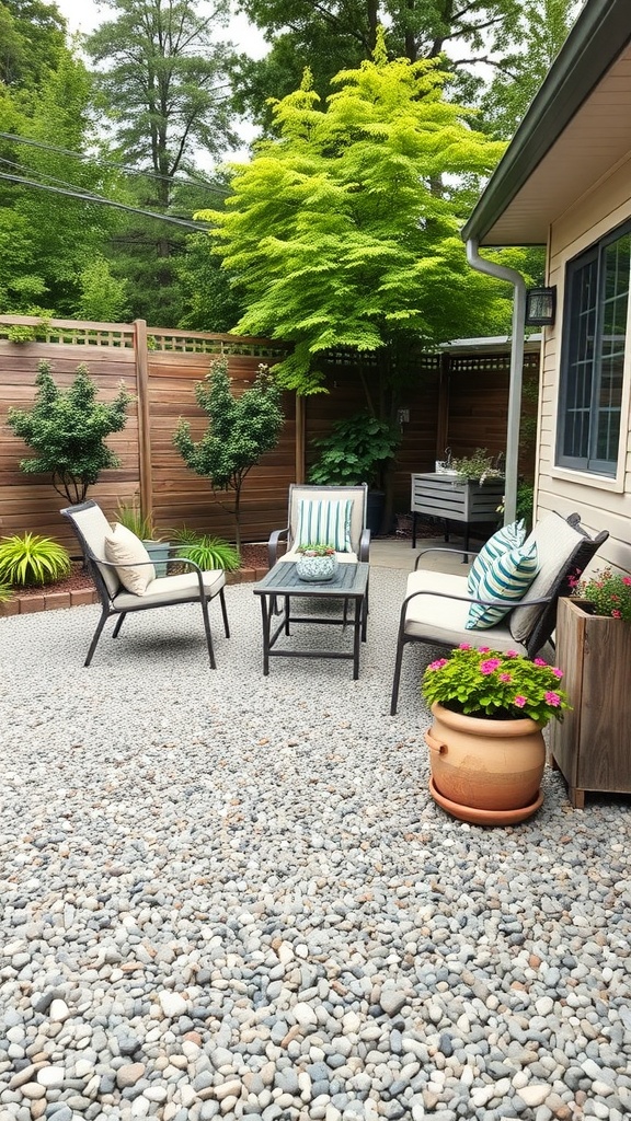 Cozy pea gravel patio area with chairs, a table, and plants.