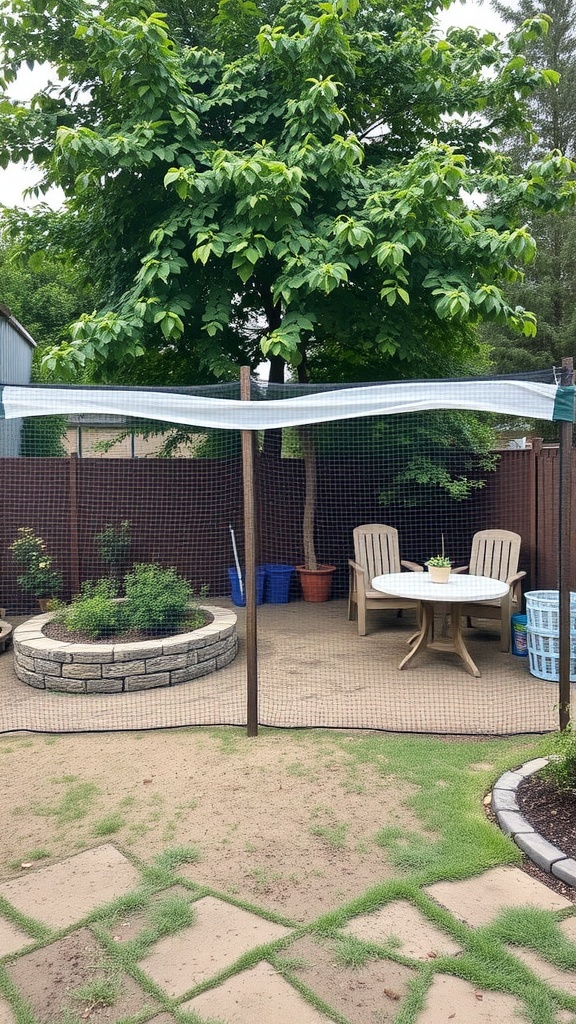 An outdoor area with netting setup around a table and chairs, surrounded by greenery.