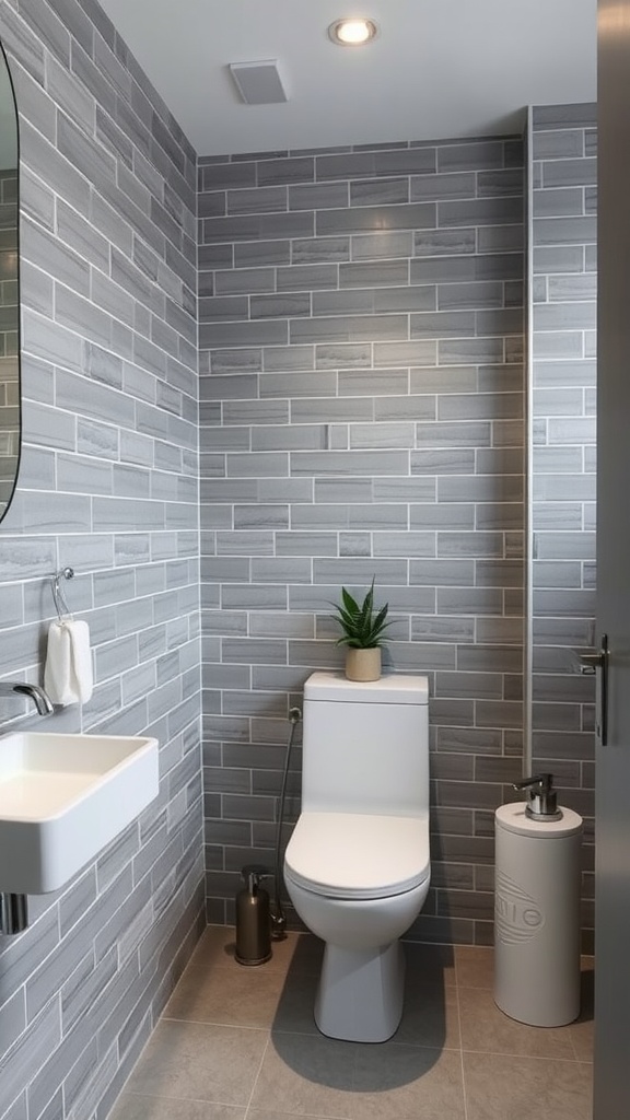 A bathroom featuring sleek grey subway tiles on the walls with modern fixtures.