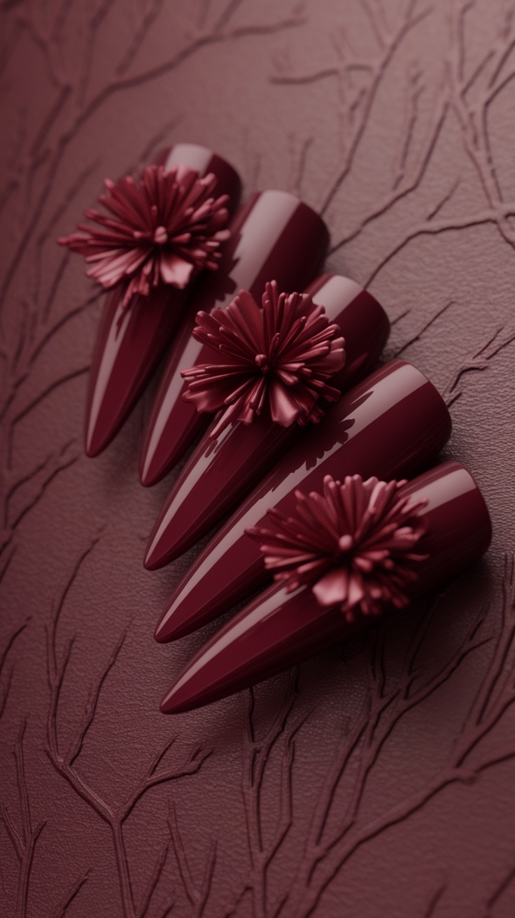 Cherry red nails with 3D floral elements on a textured background