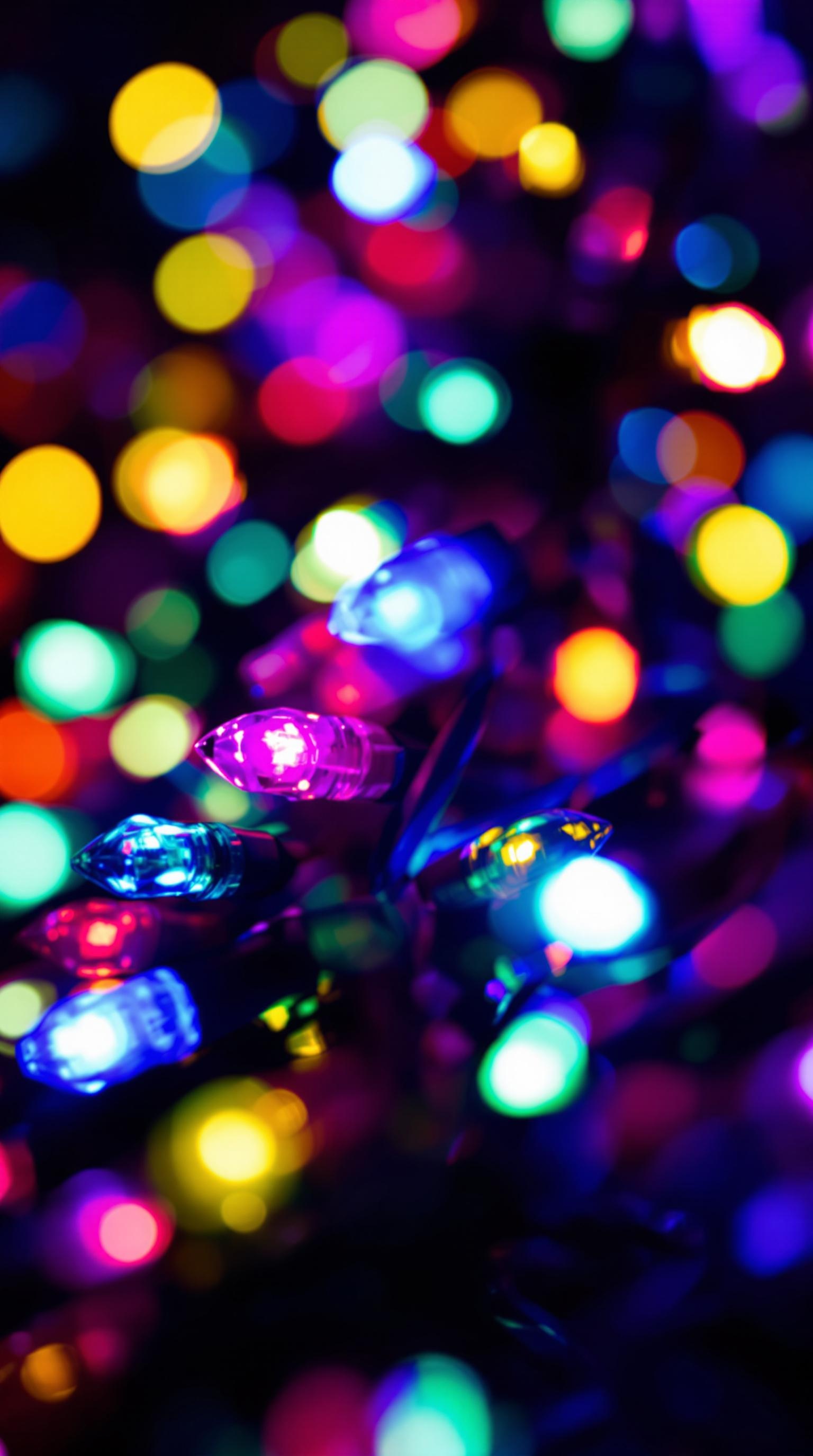 Colorful twinkling Christmas lights in a dark background