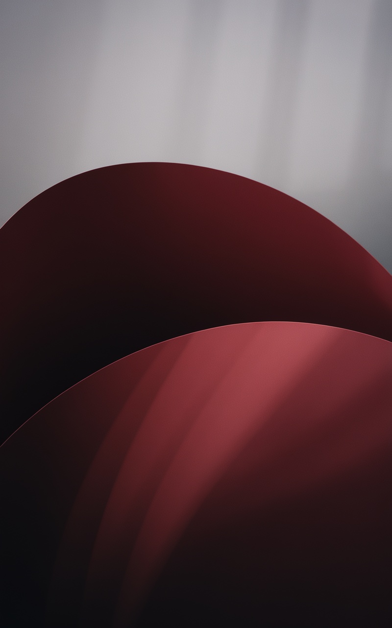 Dark cherry red wallpaper with gradients and shadows.