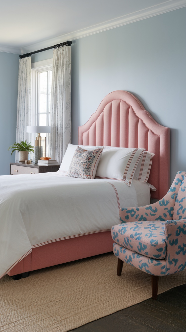 Cozy bedroom featuring a pink fabric headboard, white bedding, and a patterned armchair.