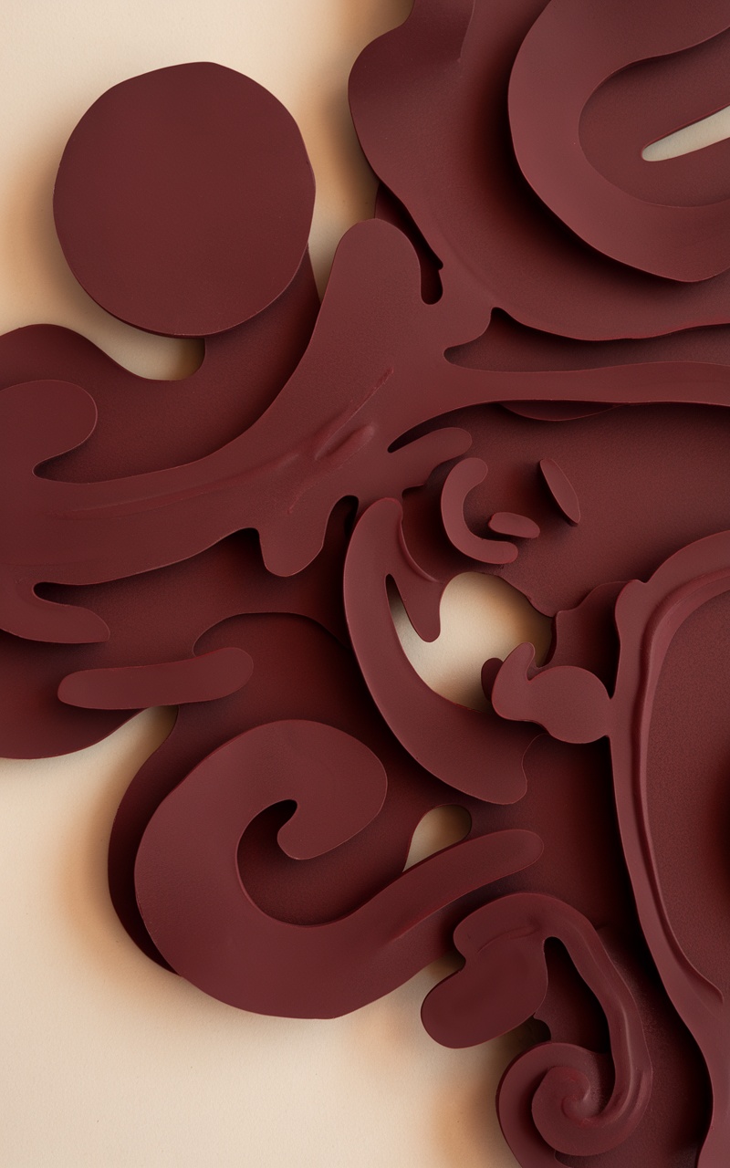 Abstract dark cherry red design with flowing shapes and forms.