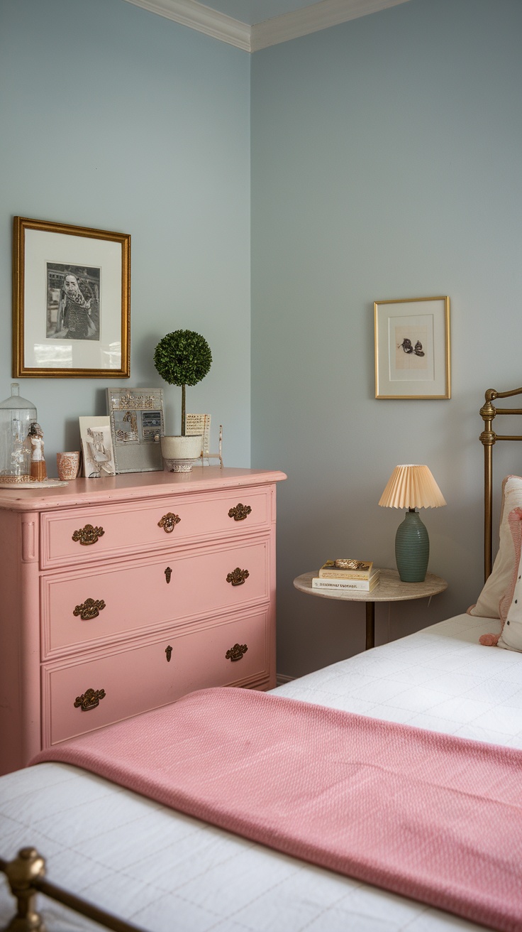 A cozy bedroom featuring a vintage pink dresser, light blue walls, and soft bedding.