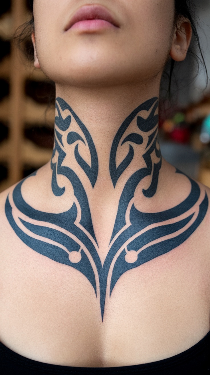 A close-up of a woman's neck with a tribal tattoo design featuring bold black patterns.