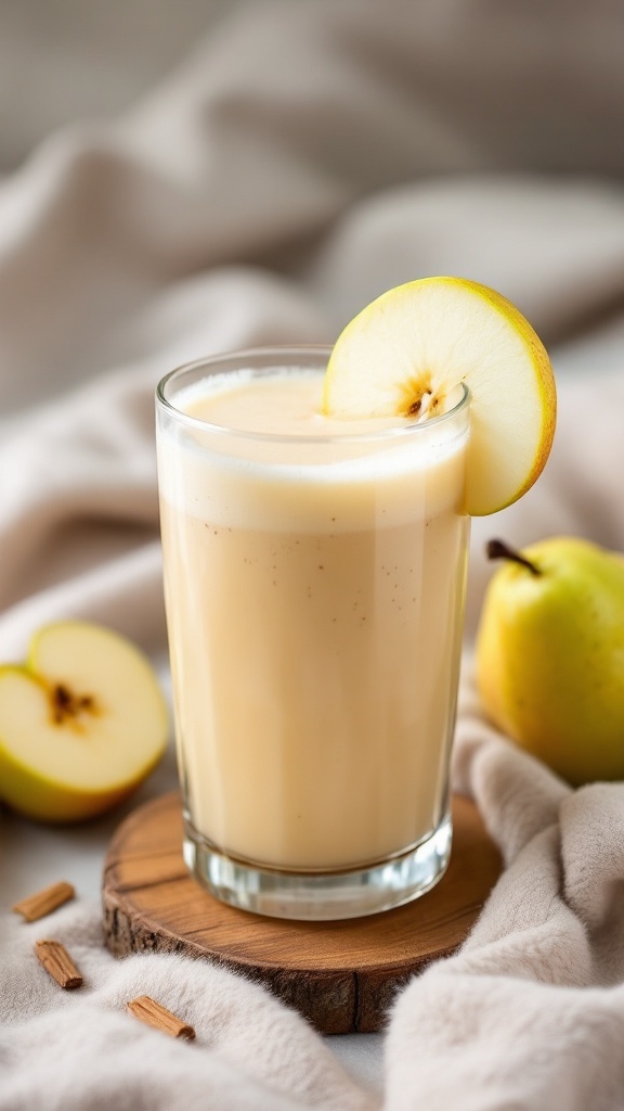 A glass of creamy apple pear vanilla juice garnished with a slice of apple.