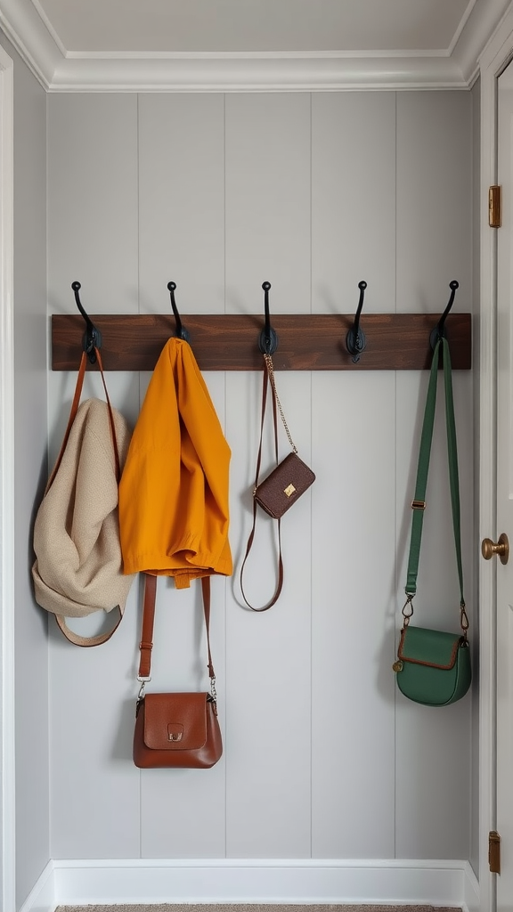 Mud room hooks displaying bags and jackets on a wooden rack.