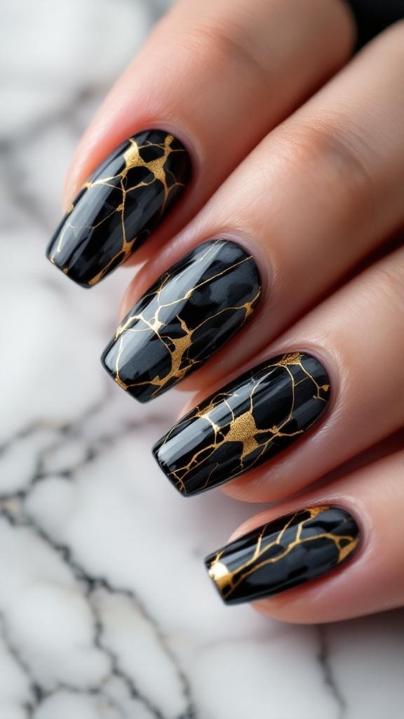 Nails featuring a bold black and gold marble effect.