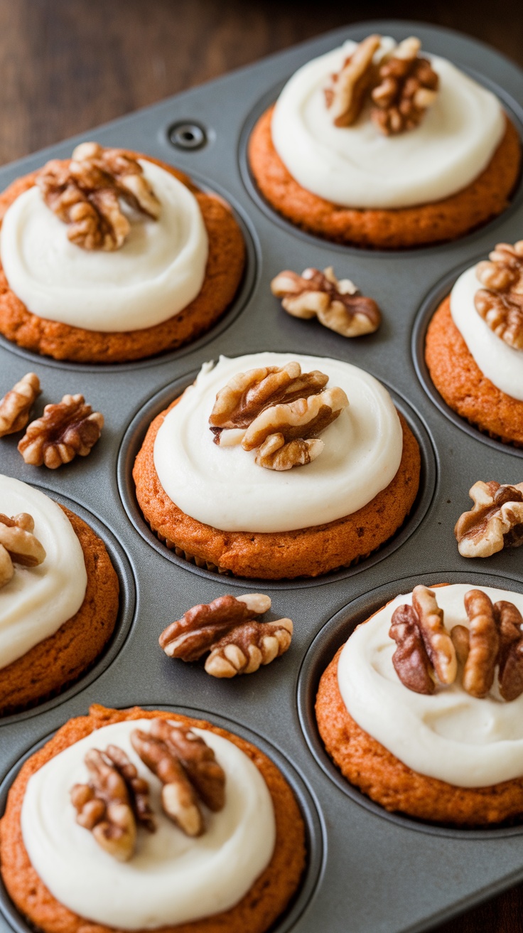 Carrot cake muffins topped with cream cheese frosting and walnuts