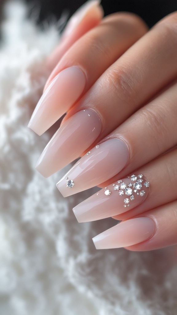 Nails with crystal clear accents and milky white tips.