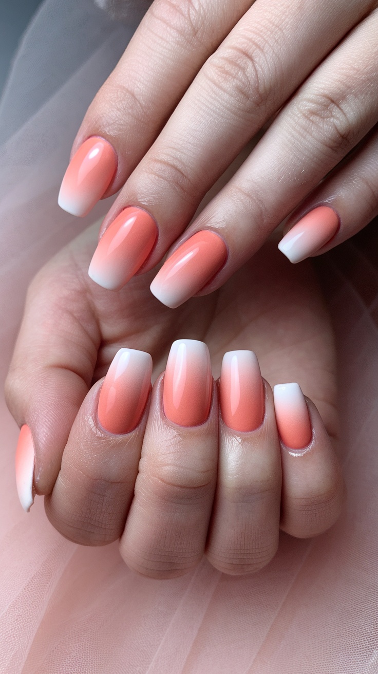 Peach ombre nails with a gradient from peach to white