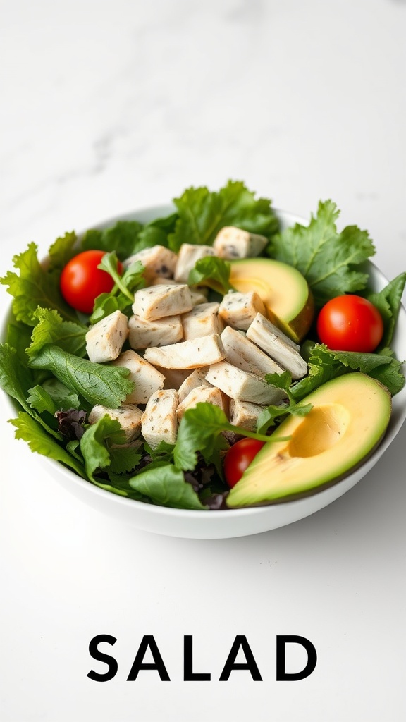 A fresh chicken avocado salad with diced chicken, avocado, greens, and cherry tomatoes.