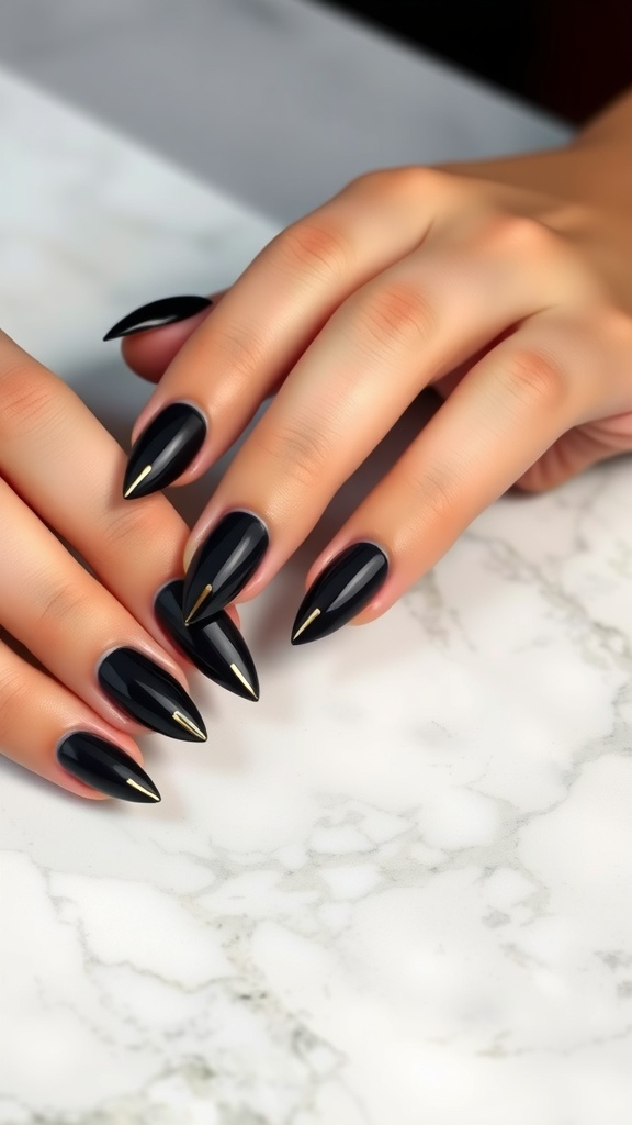 Nails featuring classic black French tips with gold accents