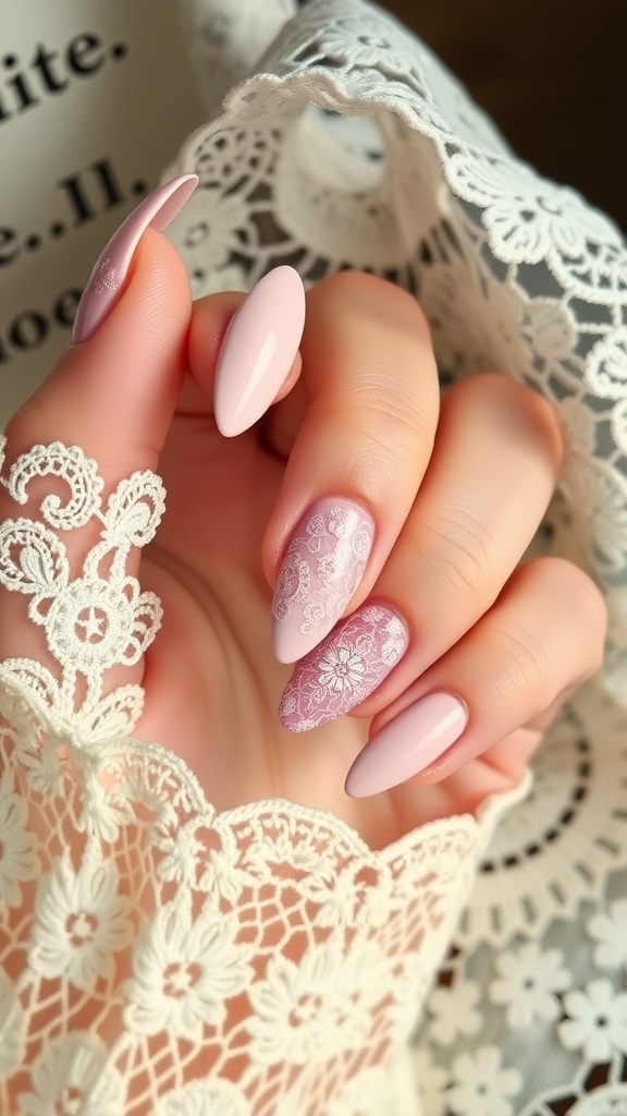 A close-up of elegant almond-shaped nails with delicate lace designs in soft pink shades.