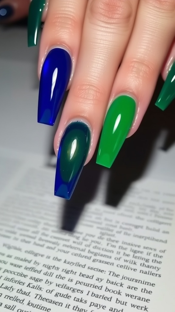 A close-up of hands with long acrylic coffin nails painted in deep green and blue shades.