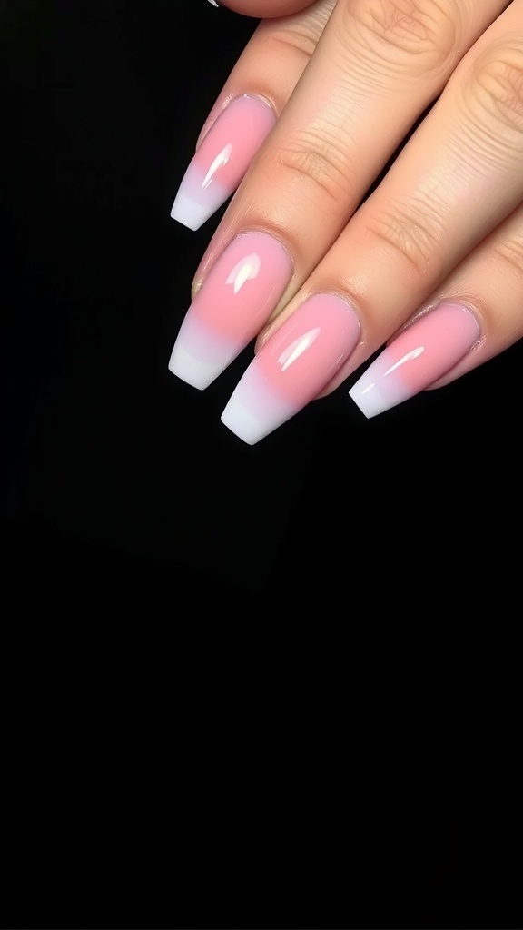 Acrylic coffin nails featuring a pink to white ombre design.