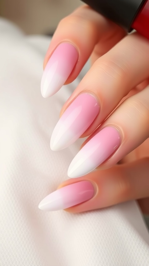 Ombre pink and white gradient nails with pointed tips