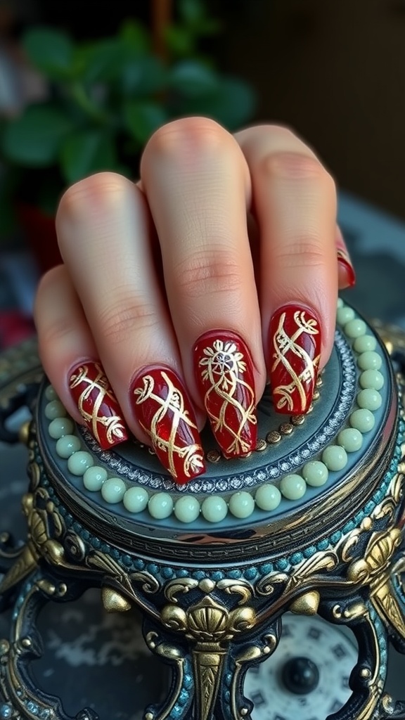Ruby red nails with gold lattice design