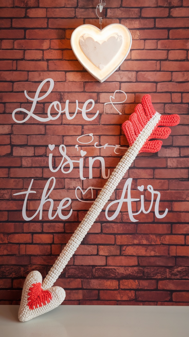 Crochet Cupid's arrow with a heart tip and a decorative wall that says 'Love is in the Air'