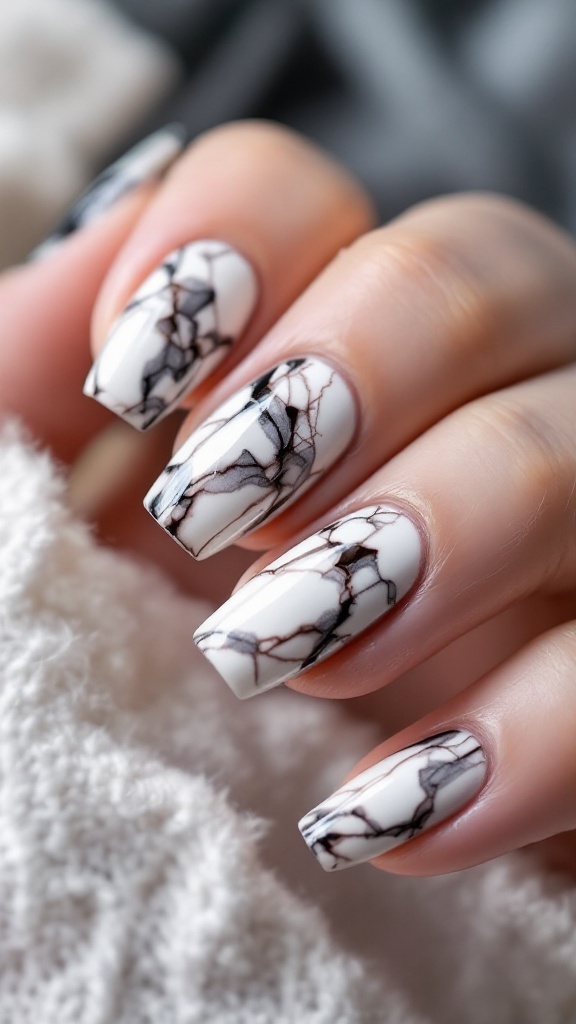 Nail design featuring a marble effect with white base and black lines