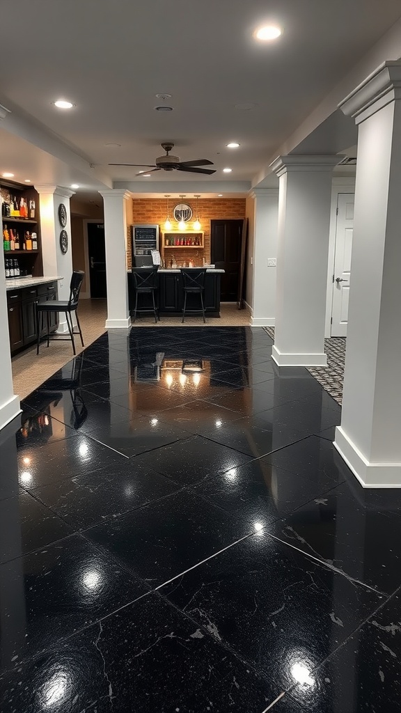 A modern basement with a polished black epoxy concrete floor, featuring a bar area and stylish decor.