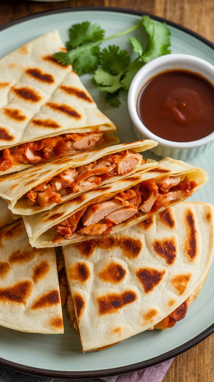 Plate of BBQ chicken quesadillas with cilantro and barbecue sauce