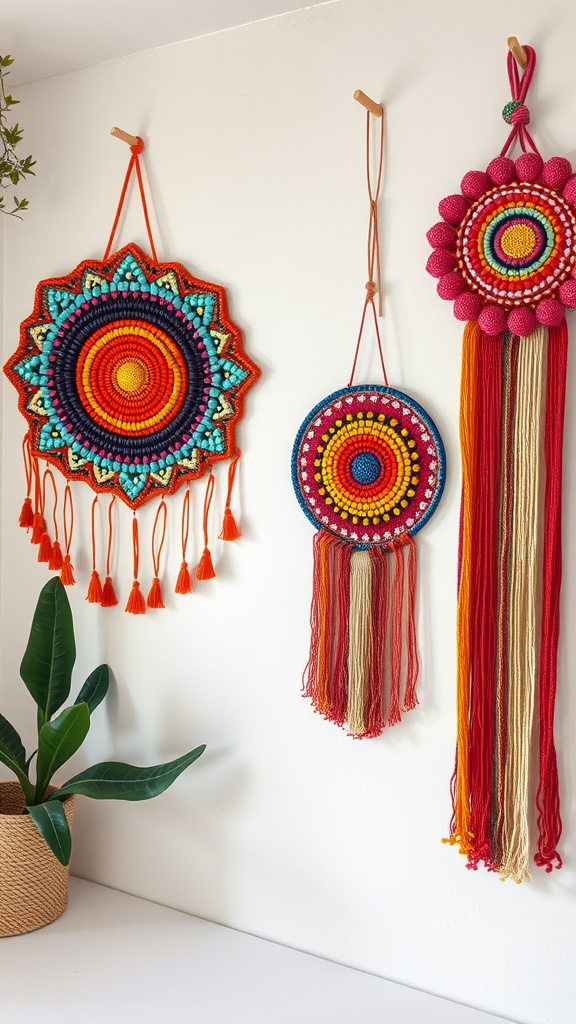 Three colorful beaded wall hangings with vibrant designs and tassels, alongside a green plant in a woven basket.